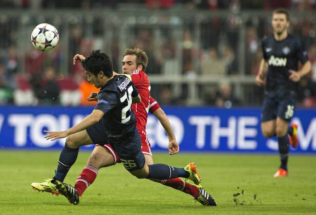 Philipp Lahm (FCB), Shinji Kagawa (ManU) 09.04.2014, München, FC Bayern München vs. Manchester United FC