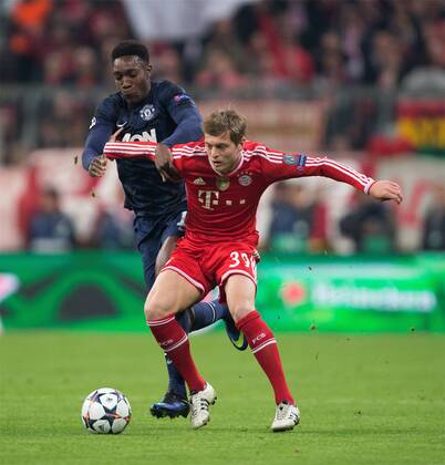 Danny Welbeck of Manchester United and Toni Kroos of Munich - UEFA Champions League - Quarter Final 2nd Leg - Bayern Munich vs. Manchester United - Allianz Arena - Munich - Germany - 9th April 2014 - Picture PhilipxOldham Sportimage EDITORIAL USE ONLY. No use with unauthorised audio, video, data, fixture lists, club league logos or live services. Online in-match use limited to 120 images, no video emulation. No use in betting, games or single club league player publications.