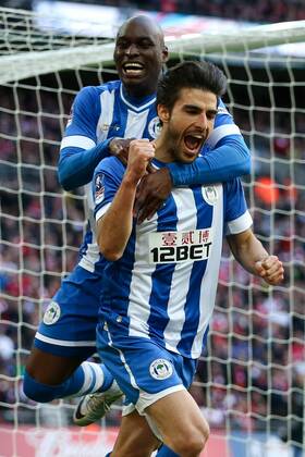 Wigan s Jordi Gomez celebrates scoring a penalty to open the scoring with Wigan s Marc-Antoine Fortune - Wigan v Arsenal - 2014 FA Cup Semi-Final - Wembley Stadium - London - 12th April 2014 - Pic Charlie Forgham-Bailey Sportimage EDITORIAL USE ONLY. No use with unauthorised audio, video, data, fixture lists, club league logos or live services. Online in-match use limited to 120 images, no video emulation. No use in betting, games or single club league player publications.