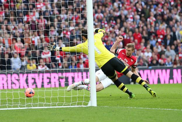 Arsenal s Per Mertesacker scoring his sides opening goal Wigan Athletic vs Arsenal- FA Cup Semi Final, Wembley Stadium - London - England - 12 04 2014 - Pic David Klein Sportimage EDITORIAL USE ONLY. No use with unauthorised audio, video, data, fixture lists, club league logos or live services. Online in-match use limited to 120 images, no video emulation. No use in betting, games or single club league player publications.