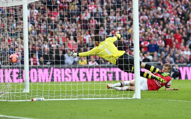 Arsenal s Per Mertesacker scoring his sides opening goal Wigan Athletic vs Arsenal- FA Cup Semi Final, Wembley Stadium - London - England - 12 04 2014 - Pic David Klein Sportimage EDITORIAL USE ONLY. No use with unauthorised audio, video, data, fixture lists, club league logos or live services. Online in-match use limited to 120 images, no video emulation. No use in betting, games or single club league player publications.