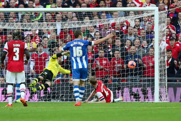 Per Mertesacker of Arsenal scoring the equaliser - Wigan v Arsenal - 2014 FA Cup Semi-Final - Wembley Stadium - London - 12th April 2014 - Pic Charlie Forgham-Bailey Sportimage EDITORIAL USE ONLY. No use with unauthorised audio, video, data, fixture lists, club league logos or live services. Online in-match use limited to 120 images, no video emulation. No use in betting, games or single club league player publications.