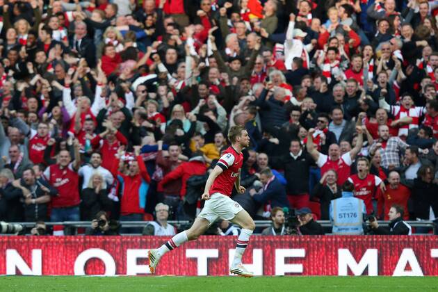 Per Mertesacker of Arsenal celebrates scoring the equaliser - Wigan v Arsenal - 2014 FA Cup Semi-Final - Wembley Stadium - London - 12th April 2014 - Pic Charlie Forgham-Bailey Sportimage EDITORIAL USE ONLY. No use with unauthorised audio, video, data, fixture lists, club league logos or live services. Online in-match use limited to 120 images, no video emulation. No use in betting, games or single club league player publications.