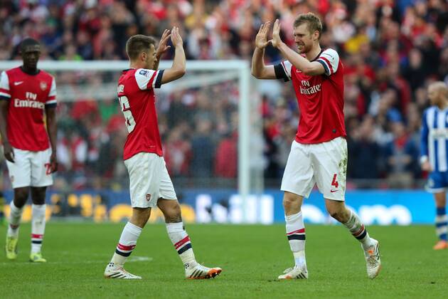 Per Mertesacker of Arsenal celebrates scoring the equaliser - Wigan v Arsenal - 2014 FA Cup Semi-Final - Wembley Stadium - London - 12th April 2014 - Pic Charlie Forgham-Bailey Sportimage EDITORIAL USE ONLY. No use with unauthorised audio, video, data, fixture lists, club league logos or live services. Online in-match use limited to 120 images, no video emulation. No use in betting, games or single club league player publications.