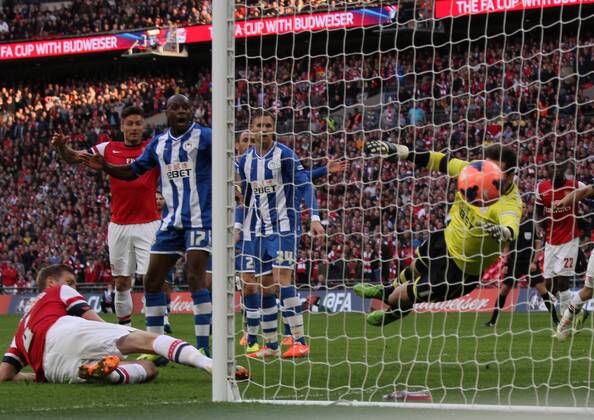 FA Cup Semi-Final - Arsenal v Wigan Athletic . . Wembley, London, UK . . 12.04.2014 Per Mertesacker (A) scores a goal for Arsenal. 1-1 
