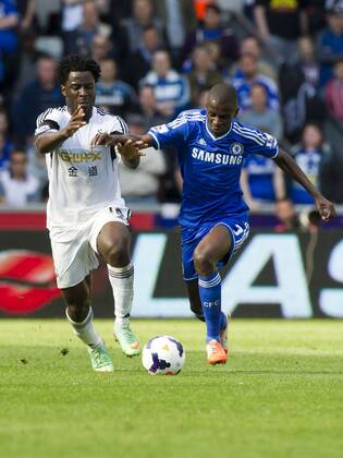 Football - 2013 2014 Premier League - Swansea City vs. Chelsea Wilfried Bony of Swansea & Ramires of Chelsea of Chelsea at the the Liberty Stadium. COLORSPORT WINSTON BYNORTH