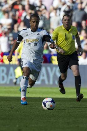 Football - 2013 2014 Premier League - Swansea City vs. Chelsea Wayne Routledge of Swansea attacks at the the Liberty Stadium. COLORSPORT WINSTON BYNORTH
