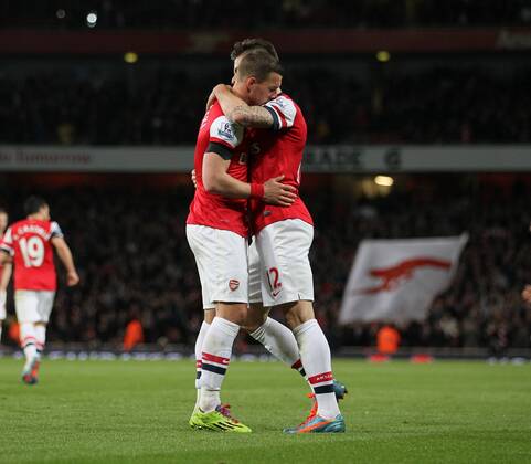 Arsenal s Lukas Podolski celebrates scoring his sides opening goal Arsenal vs West Ham United- Barclays Premier League - Emirates Stadium - London - England - 15 04 2014 - Pic David Klein Sportimage EDITORIAL USE ONLY. No use with unauthorised audio, video, data, fixture lists, club league logos or live services. Online in-match use limited to 120 images, no video emulation. No use in betting, games or single club league player publications.