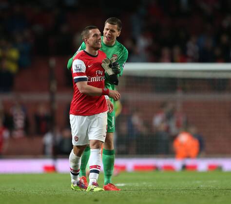 Arsenal s Lukas Podolski celebrates at the final whistle with Wojciech Szczesny Arsenal vs West Ham United- Barclays Premier League - Emirates Stadium - London - England - 15 04 2014 - Pic David Klein Sportimage EDITORIAL USE ONLY. No use with unauthorised audio, video, data, fixture lists, club league logos or live services. Online in-match use limited to 120 images, no video emulation. No use in betting, games or single club league player publications.