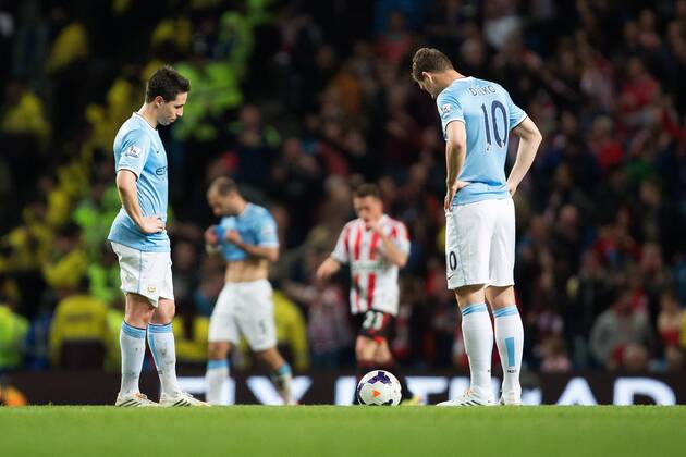 Samir Nasri and Edin Dzeko of Manchester City are left dejected following Sunderland s second goal - Barclays Premier League - Manchester City vs. AFC Sunderland FC - Etihad Stadium - Manchester - England - 16th April 2014 - EDITORIAL USE ONLY. No use with unauthorised audio, video, data, fixture lists, club league logos or live services. Online in-match use limited to 120 images, no video emulation. No use in betting, games or single club league player publications.
