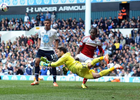 Football - 2013 2014 Premier League - Tottenham Hotspur vs. Fulham Tottenham s goalkeeper Hugo Lloris punches clear from Hugo Rodallega at White Hart Lane. Colorsport Andrew Cowie 