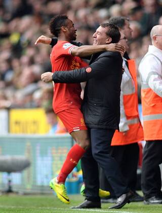 Football - 2013 2014 Premier League - Norwich City vs. Liverpool Liverpool s Raheem Sterling celebrates scoring goal no. 1 with Manager Brendan Rodgers at Carrow Road. Colorsport Andrew Cowie 