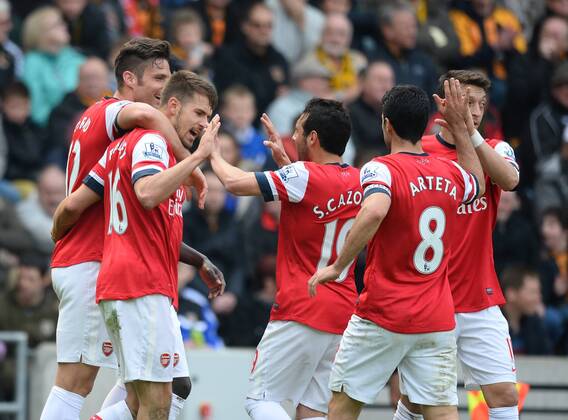 Aaron Ramsey of Arsenal (l) celebrates scoring the first goal - Barclays Premier League - Hull City v Arsenal - KC Stadium - Hull - England - 20th April 2014 - Pic Simon Bellis Sportimage EDITORIAL USE ONLY. No use with unauthorised audio, video, data, fixture lists, club league logos or live services. Online in-match use limited to 120 images, no video emulation. No use in betting, games or single club league player publications.