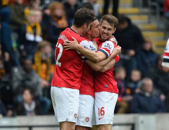 A kiss for goal provider Aaron Ramsey of Arsenal from scorer Lucas Podolski of Arsenal - Barclays Premier League - Hull City v Arsenal - KC Stadium - Hull - England - 20th April 2014 - Pic Simon Bellis Sportimage EDITORIAL USE ONLY. No use with unauthorised audio, video, data, fixture lists, club league logos or live services. Online in-match use limited to 120 images, no video emulation. No use in betting, games or single club league player publications.