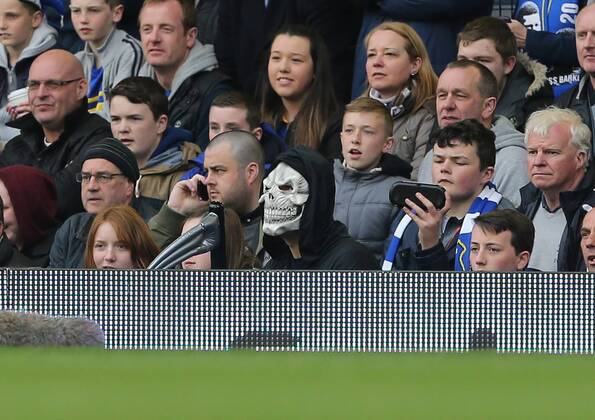 A fan dressed as the grim reaper barracks Manchester United s Davids Moyes Everton vs Manchester United- Barclays Premier League - Goodison Park - Liverpool - England - 20 04 2014 - EDITORIAL USE ONLY. No use with unauthorised audio, video, data, fixture lists, club league logos or live services. Online in-match use limited to 120 images, no video emulation. No use in betting, games or single club league player publications.