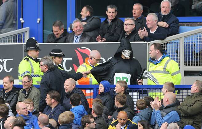 A fan dressed as the grim reaper gets esscorted out Everton vs Manchester United- Barclays Premier League - Goodison Park - Liverpool - England - 20 04 2014 - EDITORIAL USE ONLY. No use with unauthorised audio, video, data, fixture lists, club league logos or live services. Online in-match use limited to 120 images, no video emulation. No use in betting, games or single club league player publications.
