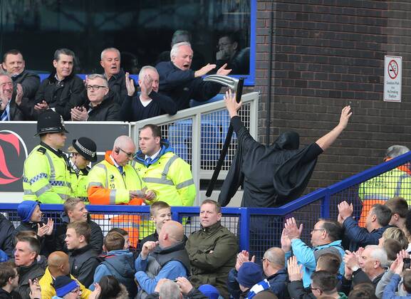 A fan dressed as the grim reaper gets escorted out Everton vs Manchester United- Barclays Premier League - Goodison Park - Liverpool - England - 20 04 2014 - EDITORIAL USE ONLY. No use with unauthorised audio, video, data, fixture lists, club league logos or live services. Online in-match use limited to 120 images, no video emulation. No use in betting, games or single club league player publications.