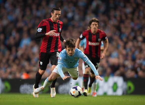 West Brom s Morgan Amalfitano takes down David Silva of Manchester City - Barclays Premier League - Manchester City vs. West Bromwich Albion - Etihad Stadium - Manchester - England - 21st April 2014 - Pic by Philip Oldham SportImage EDITORIAL USE ONLY. No use with unauthorised audio, video, data, fixture lists, club league logos or live services. Online in-match use limited to 120 images, no video emulation. No use in betting, games or single club league player publications.