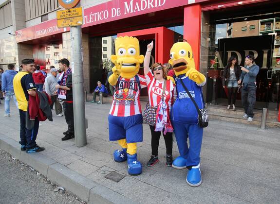 An Atletico Madrid fan with dressed up as Bart and Homer Simpson - Champions League, SemiFinal, First leg - Vicente Calderon Stadium - 22 04 2014 - EDITORIAL USE ONLY. No use with unauthorised audio, video, data, fixture lists, club league logos or live services. Online in-match use limited to 120 images, no video emulation. No use in betting, games or single club league player publications.