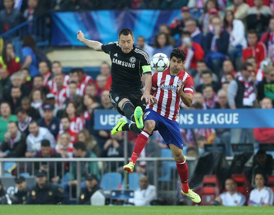 Atletico Madrid s Diego Costa tussles with Chelsea s John Terry - Champions League, SemiFinal, First leg - Vicente Calderon Stadium - 22 04 2014 - EDITORIAL USE ONLY. No use with unauthorised audio, video, data, fixture lists, club league logos or live services. Online in-match use limited to 120 images, no video emulation. No use in betting, games or single club league player publications.