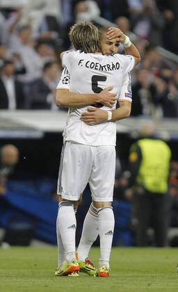 Soccer match between Real Madrid and FC Bayern München of semifinals of semifinals of the Champions League, held at the Santiago Bernabeu stadium, in Madrid 04 23 2014. Karim Benzema and Fabio Coentrao celebrate after scoring 