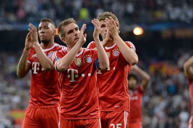 FUSSBALL CHAMPIONS LEAGUE HALBFINAL HINSPIEL SAISON 2013 2014 Real Madrid - FC Bayern München 23.04.2014 Jerome Boateng, Philipp Lahm und Thomas Mueller (v.l., alle FC Bayern München) sind nach dem Abpfiff nicht ganz zufrieden 