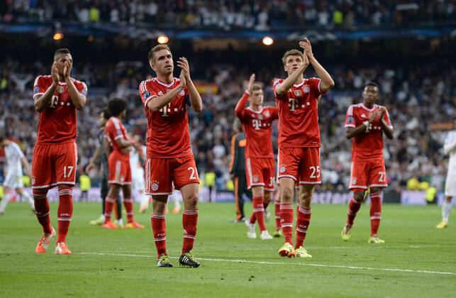 FUSSBALL CHAMPIONS LEAGUE HALBFINAL HINSPIEL SAISON 2013 2014 Real Madrid - FC Bayern München 23.04.2014 Jerome Boateng, Philipp Lahm, Thomas Mueller (v.l., alle FC Bayern München) sind nach dem Abpfiff nicht ganz zufrieden 