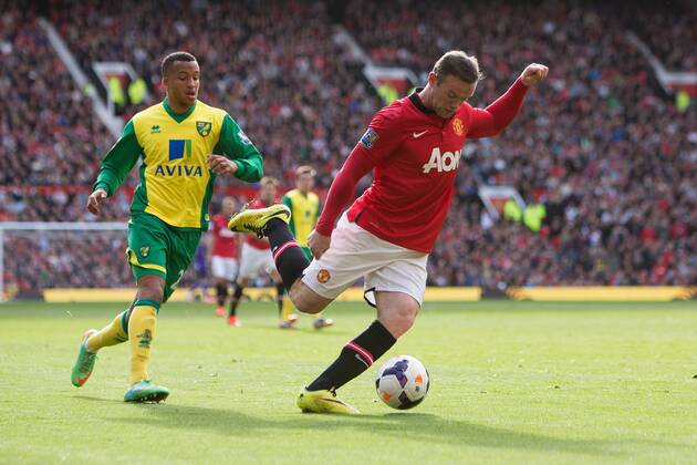 Wayne Rooney of Manchester United in action - Barclays Premier League - Manchester United vs. Norwich - Old Trafford - Manchester - England - 19th April 2014 - Pic by Philip Oldham SportImage EDITORIAL USE ONLY. No use with unauthorised audio, video, data, fixture lists, club league logos or live services. Online in-match use limited to 120 images, no video emulation. No use in betting, games or single club league player publications.