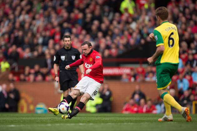 Wayne Rooney of Manchester United scores his sides second goal - Barclays Premier League - Manchester United vs. Norwich - Old Trafford - Manchester - England - 19th April 2014 - Pic by Philip Oldham SportImage EDITORIAL USE ONLY. No use with unauthorised audio, video, data, fixture lists, club league logos or live services. Online in-match use limited to 120 images, no video emulation. No use in betting, games or single club league player publications.