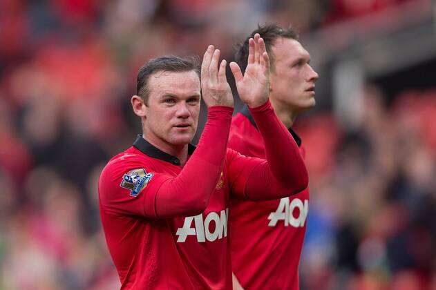 Wayne Rooney of Manchester United applauds the fans at full time - Barclays Premier League - Manchester United vs. Norwich - Old Trafford - Manchester - England - 19th April 2014 - Pic by Philip Oldham SportImage EDITORIAL USE ONLY. No use with unauthorised audio, video, data, fixture lists, club league logos or live services. Online in-match use limited to 120 images, no video emulation. No use in betting, games or single club league player publications.