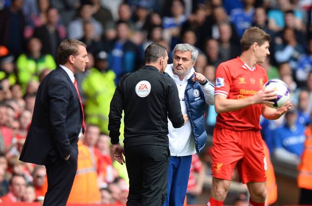Sequence picture 1 of 9 Jose Mourinho manager of Chelsea keeps the ball from Jon Flanagan of Liverpool and Steven Gerrard of Liverpool - Barclays Premier League - FC Liverpool - Chelsea FC London - Anfield Stadium - Liverpool - England - 27th April 2014 - EDITORIAL USE ONLY. No use with unauthorised audio, video, data, fixture lists, club league logos or live services. Online in-match use limited to 120 images, no video emulation. No use in betting, games or single club league player publications.