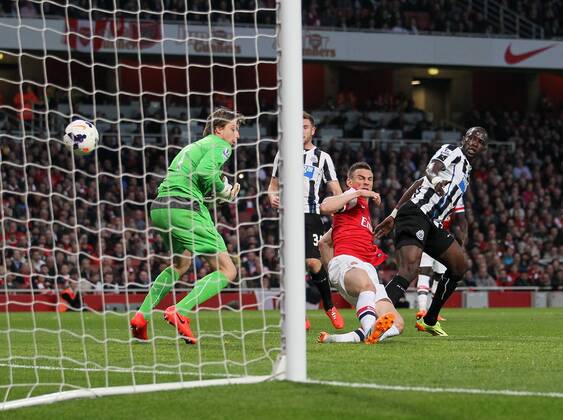 Arsenal s Laurent Koscielny scoring his sides opening goal Arsenal vs Newcastle United - Barclays Premier League - Emirates Stadium - London - UK - 28 04 2014 - Pic David Klein Sportimage EDITORIAL USE ONLY. No use with unauthorised audio, video, data, fixture lists, club league logos or live services. Online in-match use limited to 120 images, no video emulation. No use in betting, games or single club league player publications.