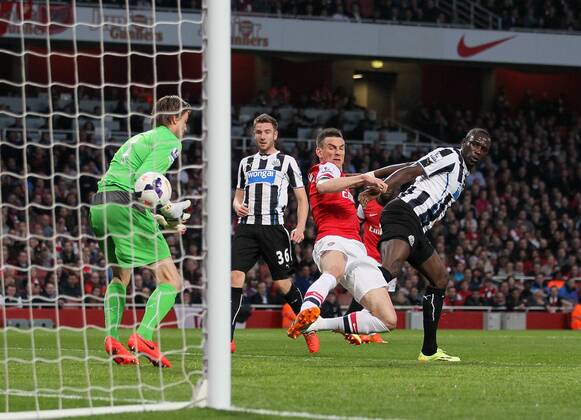 Arsenal s Laurent Koscielny scoring his sides opening goal Arsenal vs Newcastle United - Barclays Premier League - Emirates Stadium - London - UK - 28 04 2014 - Pic David Klein Sportimage EDITORIAL USE ONLY. No use with unauthorised audio, video, data, fixture lists, club league logos or live services. Online in-match use limited to 120 images, no video emulation. No use in betting, games or single club league player publications.