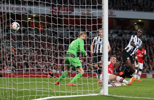 Arsenal s Laurent Koscielny scoring his sides opening goal Arsenal vs Newcastle United - Barclays Premier League - Emirates Stadium - London - UK - 28 04 2014 - Pic David Klein Sportimage EDITORIAL USE ONLY. No use with unauthorised audio, video, data, fixture lists, club league logos or live services. Online in-match use limited to 120 images, no video emulation. No use in betting, games or single club league player publications.