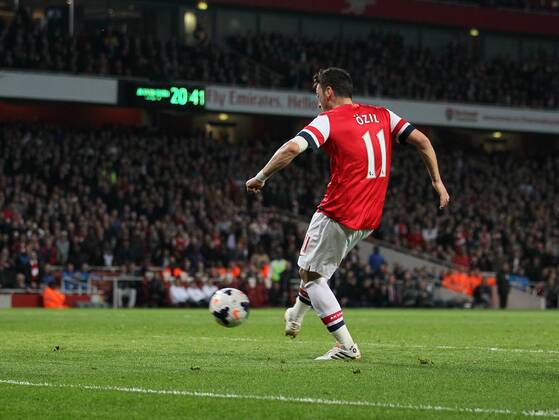 Arsenal s Mesut Özil scoring his sides second goal Arsenal vs Newcastle United - Barclays Premier League - Emirates Stadium - London - UK - 28 04 2014 - Pic David Klein Sportimage EDITORIAL USE ONLY. No use with unauthorised audio, video, data, fixture lists, club league logos or live services. Online in-match use limited to 120 images, no video emulation. No use in betting, games or single club league player publications.