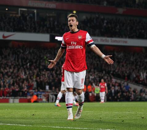 Arsenal s Mesut Özil celebrates scoring his sides second goal Arsenal vs Newcastle United - Barclays Premier League - Emirates Stadium - London - UK - 28 04 2014 - Pic David Klein Sportimage EDITORIAL USE ONLY. No use with unauthorised audio, video, data, fixture lists, club league logos or live services. Online in-match use limited to 120 images, no video emulation. No use in betting, games or single club league player publications.