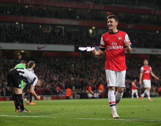 Arsenal s Mesut Özil celebrates scoring his sides second goal Arsenal vs Newcastle United - Barclays Premier League - Emirates Stadium - London - UK - 28 04 2014 - Pic David Klein Sportimage EDITORIAL USE ONLY. No use with unauthorised audio, video, data, fixture lists, club league logos or live services. Online in-match use limited to 120 images, no video emulation. No use in betting, games or single club league player publications.