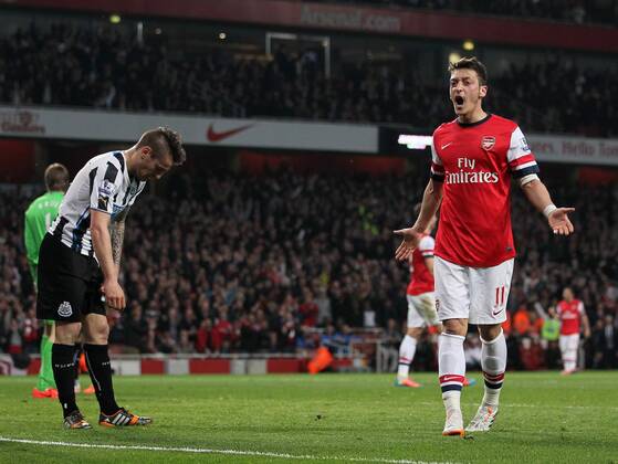 Arsenal s Mesut Özil celebrates scoring his sides second goal Arsenal vs Newcastle United - Barclays Premier League - Emirates Stadium - London - UK - 28 04 2014 - Pic David Klein Sportimage EDITORIAL USE ONLY. No use with unauthorised audio, video, data, fixture lists, club league logos or live services. Online in-match use limited to 120 images, no video emulation. No use in betting, games or single club league player publications.