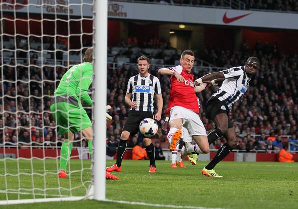 Arsenal s Laurent Koscielny scoring his sides opening goal Arsenal vs Newcastle United - Barclays Premier League - Emirates Stadium - London - UK - 28 04 2014 - Pic David Klein Sportimage EDITORIAL USE ONLY. No use with unauthorised audio, video, data, fixture lists, club league logos or live services. Online in-match use limited to 120 images, no video emulation. No use in betting, games or single club league player publications.