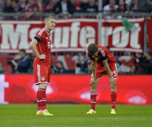29.04.2014, Fussball Champions League 2013 2014, Halbfinale, Rückspiel, FC Bayern München - Real Madrid, in der Allianz-Arena München. Frust nach dem 3. Gegentor, v.li: Bastian Schweinsteiger (München) und Thomas Müller (Bayern München). 