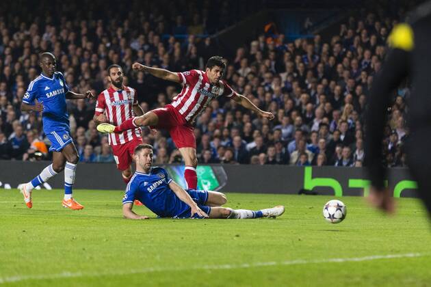 30.04.2014. London, England. Atletico Madrid& x2019;s Diego COSTA gets a shot in despite the tackle of Chelsea s Gary CAHILL during the Champions League Semi Final match between Chelsea and Atletico Madrid at Stamford Bridge. xCraigxMercerx  ActionPlus20448649