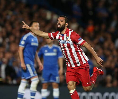 Atletico s Arda Turan celebrates scoring his sides third goal Chelsea vs Atletico Madrid - Champions League, Semi Final, 2nd leg- Stamford Bridge - London - UK - 30 04 2014 - Pic David Klein Sportimage EDITORIAL USE ONLY. No use with unauthorised audio, video, data, fixture lists, club league logos or live services. Online in-match use limited to 120 images, no video emulation. No use in betting, games or single club league player publications.