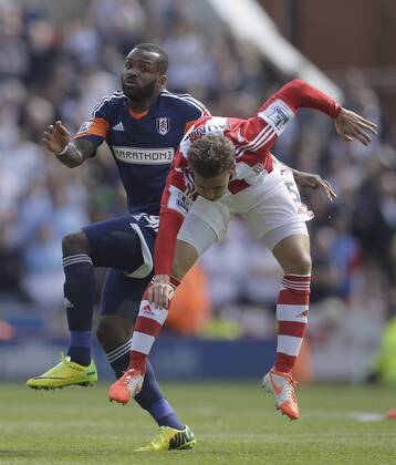 Darren Bent of Fulham competes with Marc Muniesa of Stoke City - Football - Barclays Premier League - Stoke City vs Fulham - Britannia Stadium Stoke - Season 2013 14 - 3 5 2014 - Pic Malcolm Couzens Sportimage EDITORIAL USE ONLY. No use with unauthorised audio, video, data, fixture lists, club league logos or live services. Online in-match use limited to 120 images, no video emulation. No use in betting, games or single club league player publications.