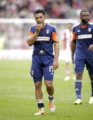 Dejection for Kieran Richardson of Fulham the end of the game as relegation is confirmed - Football - Barclays Premier League - Stoke City vs Fulham - Britannia Stadium Stoke - Season 2013 14 - 3 5 2014 - Pic Malcolm Couzens Sportimage EDITORIAL USE ONLY. No use with unauthorised audio, video, data, fixture lists, club league logos or live services. Online in-match use limited to 120 images, no video emulation. No use in betting, games or single club league player publications.