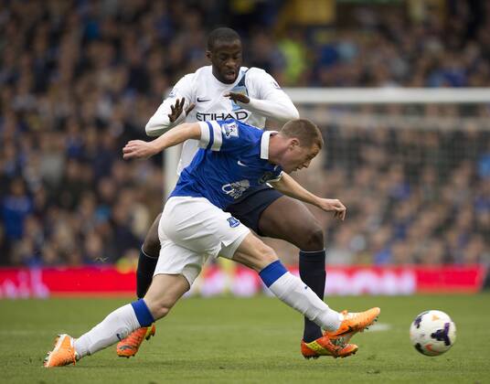 James McCarthy of Everton tussles with Yaya Toure of Manchester City - Barclays Premier League - Everton v Manchester City - Goodison Park Stadium - Liverpool - England - 3rd May 2014 - Pic Simon Bellis Sportimage EDITORIAL USE ONLY. No use with unauthorised audio, video, data, fixture lists, club league logos or live services. Online in-match use limited to 120 images, no video emulation. No use in betting, games or single club league player publications.