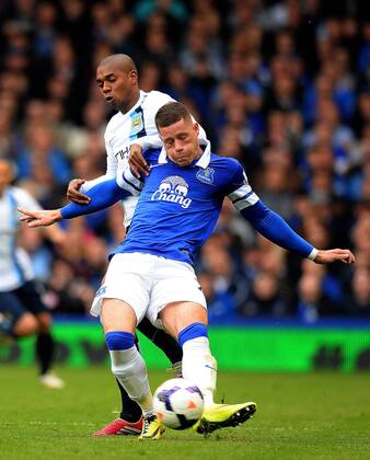 Ross Barkley of Everton tussles with Fernandinho of Manchester City - Barclays Premier League - Everton v Manchester City - Goodison Park Stadium - Liverpool - England - 3rd May 2014 - Pic Simon Bellis Sportimage EDITORIAL USE ONLY. No use with unauthorised audio, video, data, fixture lists, club league logos or live services. Online in-match use limited to 120 images, no video emulation. No use in betting, games or single club league player publications.