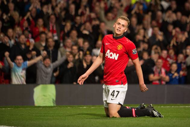 James Wilson of Manchester United celebrates his second goal - Barclays Premier League - Manchester United (ManU) vs. Hull City - Old Trafford - Manchester - England - 6th May 2014 - EDITORIAL USE ONLY. No use with unauthorised audio, video, data, fixture lists, club league logos or live services. Online in-match use limited to 120 images, no video emulation. No use in betting, games or single club league player publications.