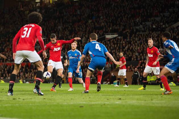 Robin van Persie of Manchester United scores his sides third goal - Barclays Premier League - Manchester United (ManU) vs. Hull City - Old Trafford - Manchester - England - 6th May 2014 - EDITORIAL USE ONLY. No use with unauthorised audio, video, data, fixture lists, club league logos or live services. Online in-match use limited to 120 images, no video emulation. No use in betting, games or single club league player publications.