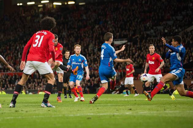 Robin van Persie of Manchester United scores his sides third goal - Barclays Premier League - Manchester United (ManU) vs. Hull City - Old Trafford - Manchester - England - 6th May 2014 - EDITORIAL USE ONLY. No use with unauthorised audio, video, data, fixture lists, club league logos or live services. Online in-match use limited to 120 images, no video emulation. No use in betting, games or single club league player publications.