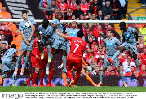 Luis Suarez of Liverpool fires his fee kick into the Newcastle wall - Barclays Premier League - Liverpool FC vs Newcastle United - Anfield Stadium - Liverpool - England - 11th May 2014 - EDITORIAL USE ONLY. No use with unauthorised audio, video, data, fixture lists, club league logos or live services. Online in-match use limited to 120 images, no video emulation. No use in betting, games or single club league player publications.